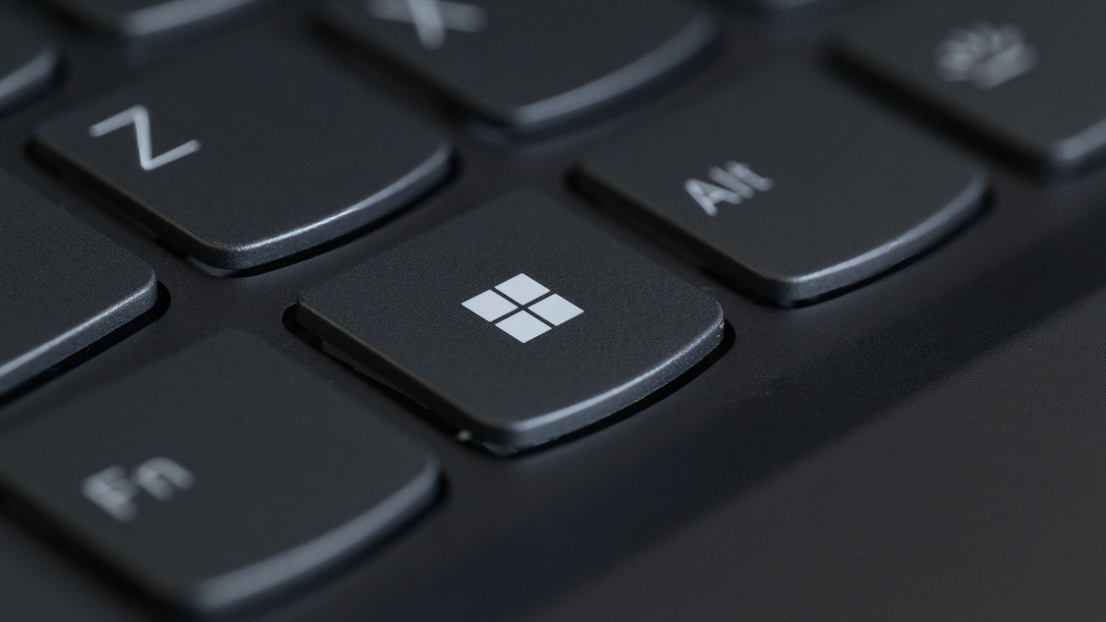Close-up of the Windows key on a black computer keyboard